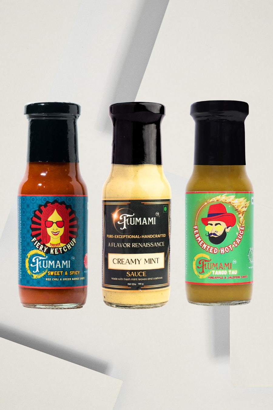Three bottles of Fumami bestseller fermented sauces on a light gray background